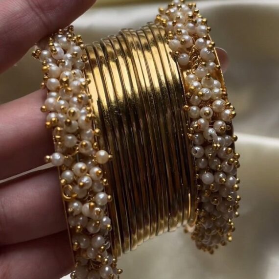 gold bangles with white kara
