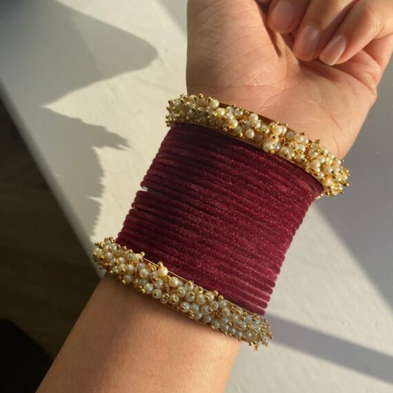 Maroon and gold bangles